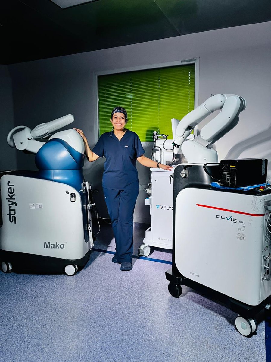Dr. Roohi Reddy, Co-Founder of OssifiDE, with robotic joint replacement systems